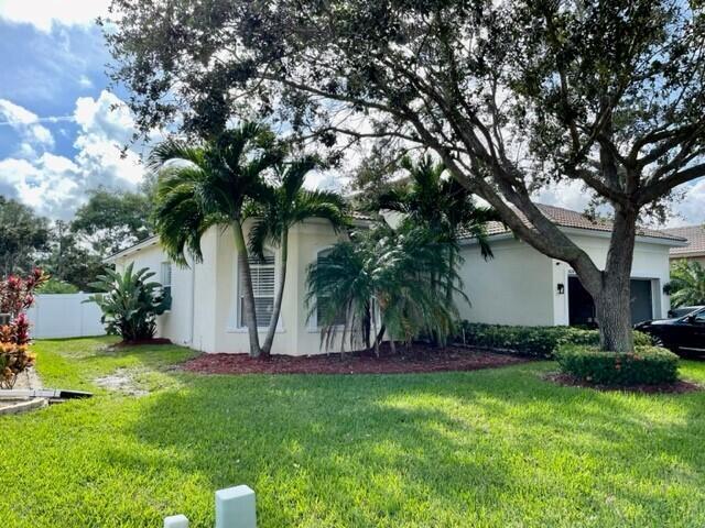 view of side of home featuring a lawn