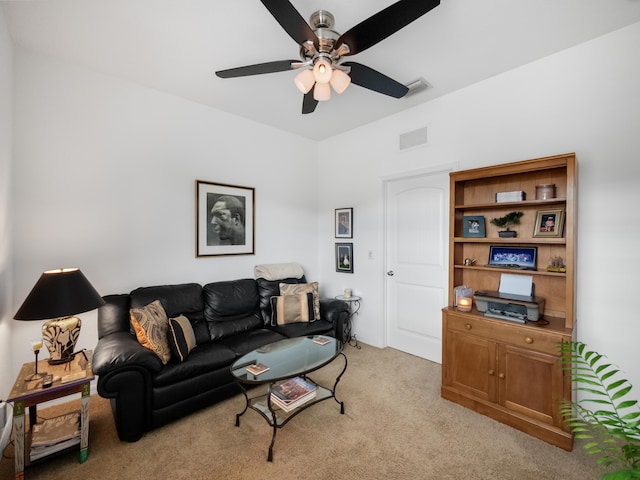 carpeted living room featuring ceiling fan