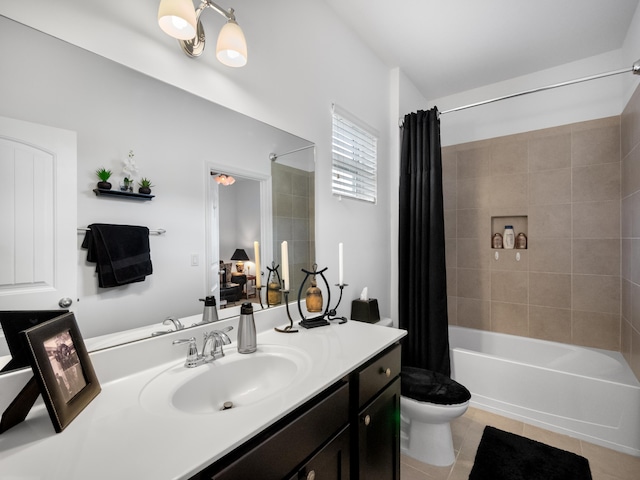 full bathroom featuring vanity, toilet, tile patterned floors, and shower / bath combo