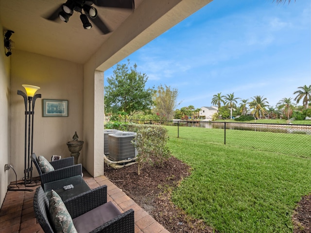 view of yard with ceiling fan, a patio area, and central air condition unit