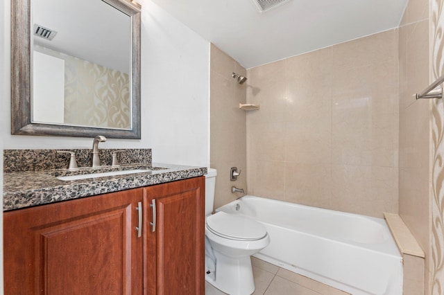 full bathroom with vanity, toilet, tile patterned flooring, and tiled shower / bath combo