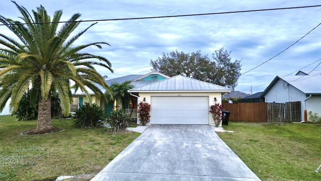 single story home with a garage and a front lawn