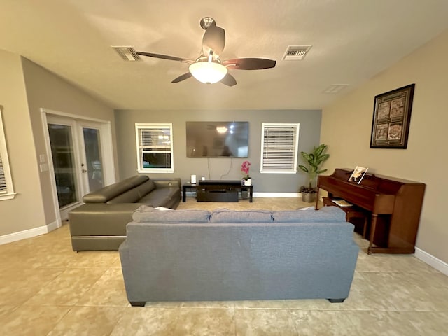 living room featuring ceiling fan and light tile patterned floors