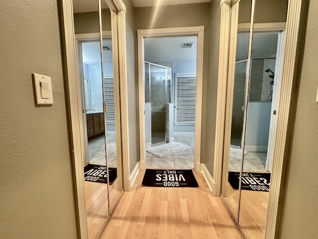 hallway featuring hardwood / wood-style floors