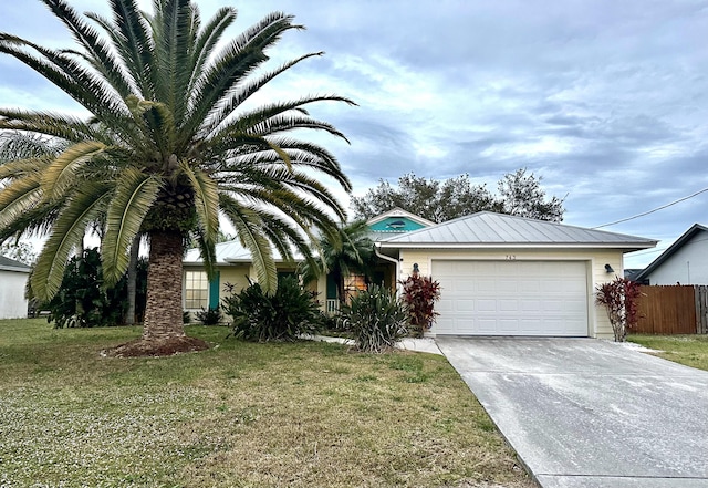 single story home with a front lawn and a garage