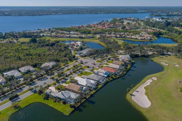 1401 SE Glencoe Ct, Port Saint Lucie, FL 34952 - drone / aerial view featuring a water view, view of golf course, and a residential view