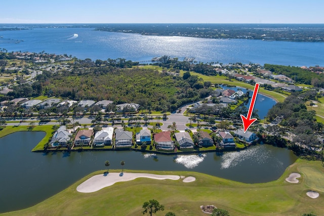 1401 SE Glencoe Ct, Port Saint Lucie, FL 34952 - drone / aerial view with a residential view, view of golf course, and a water view