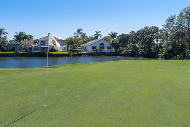 1401 SE Glencoe Ct, Port Saint Lucie, FL 34952 - view of property's community with a lawn and a water view