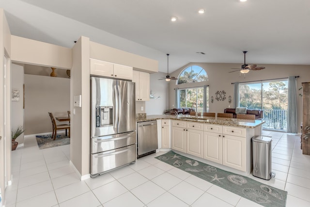 1401 SE Glencoe Ct, Port Saint Lucie, FL 34952 - kitchen featuring a ceiling fan, a sink, appliances with stainless steel finishes, and open floor plan