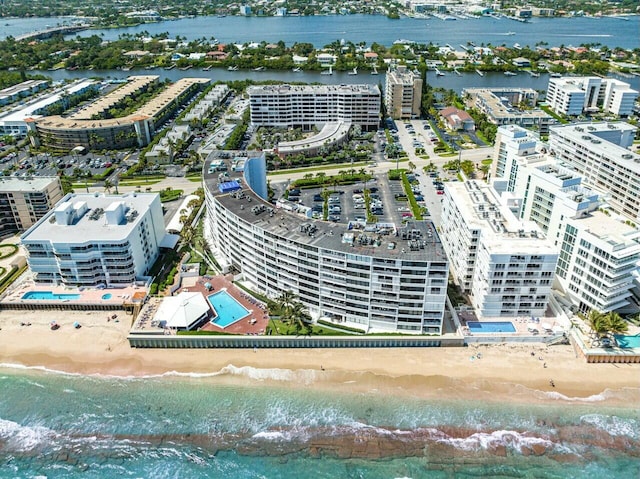 aerial view featuring a water view and a beach view