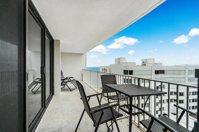 balcony featuring a water view