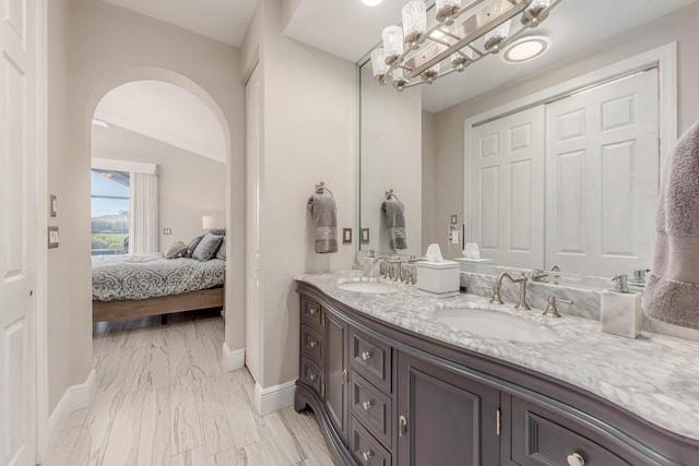 bathroom featuring vanity and lofted ceiling