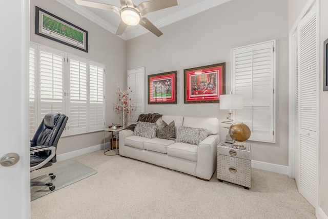 carpeted office with crown molding and ceiling fan