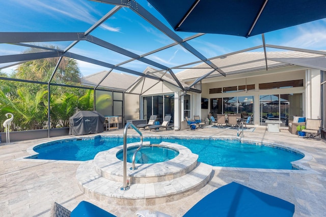 view of swimming pool featuring grilling area, an in ground hot tub, glass enclosure, and a patio