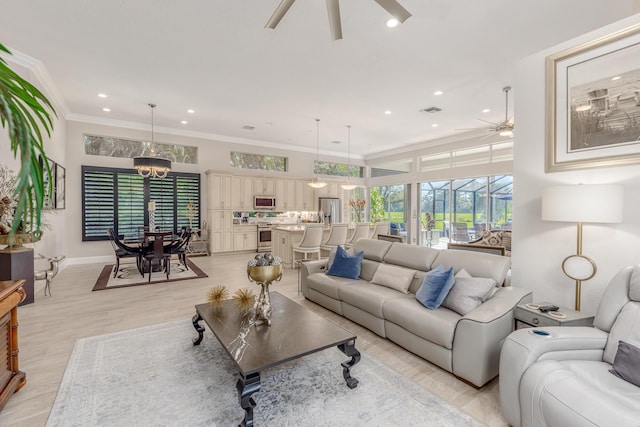 living room with crown molding and ceiling fan