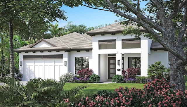 view of front facade with a garage and a front yard