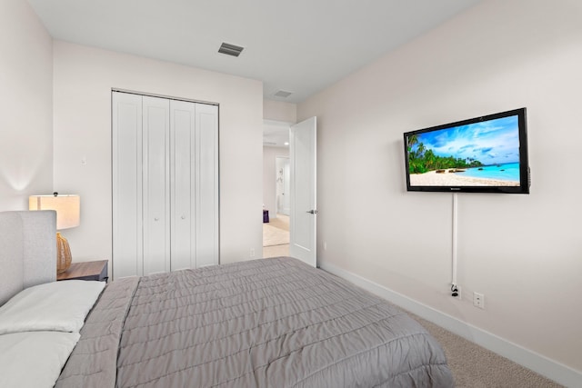 carpeted bedroom featuring a closet