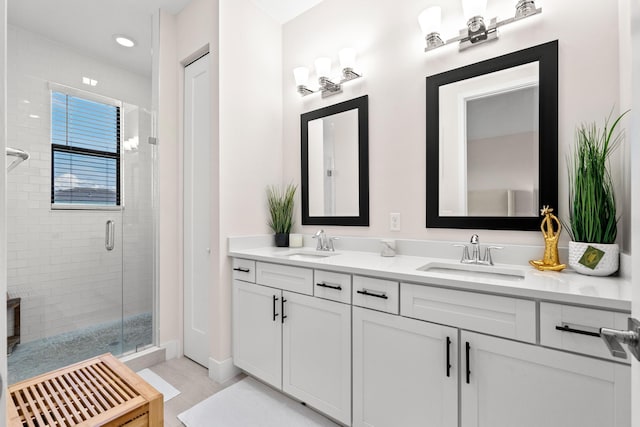 bathroom featuring vanity, tile patterned flooring, and an enclosed shower