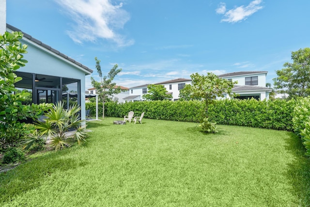 view of yard with a sunroom