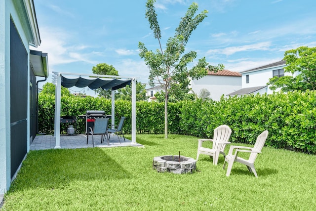 view of yard featuring a patio area and an outdoor fire pit