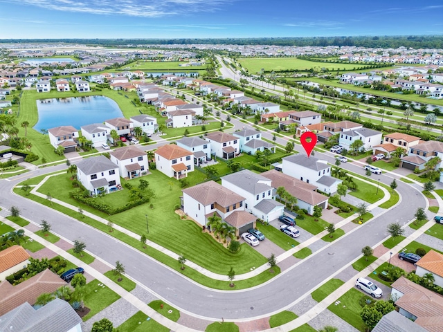 birds eye view of property featuring a water view