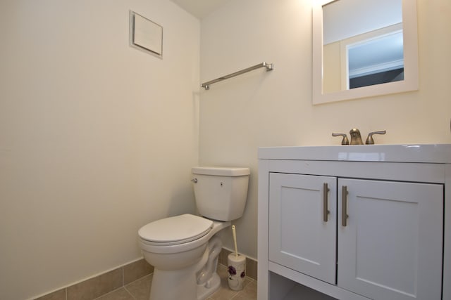 bathroom featuring vanity, tile patterned floors, and toilet