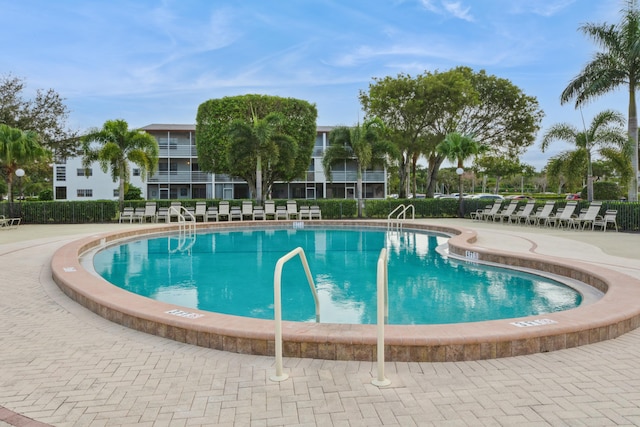 view of swimming pool with a patio