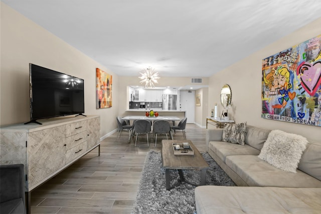 living room featuring an inviting chandelier