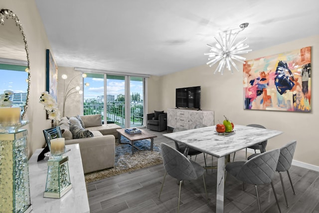 dining space featuring a wall of windows and a chandelier