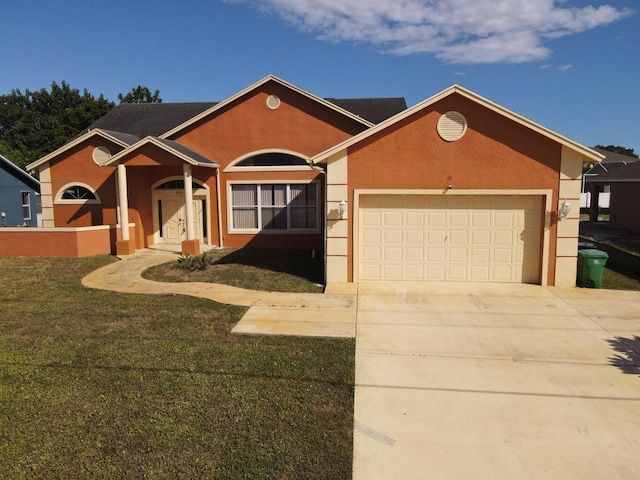 ranch-style house featuring a garage and a front lawn