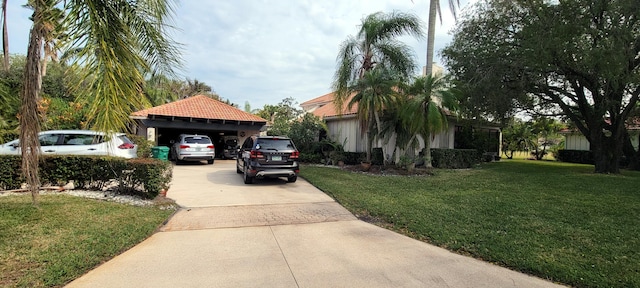 view of front facade with a front yard and a carport