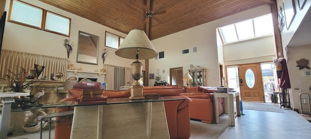 interior space featuring a towering ceiling and wood ceiling