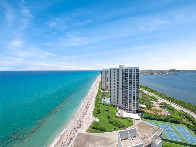 birds eye view of property featuring a water view and a view of the beach