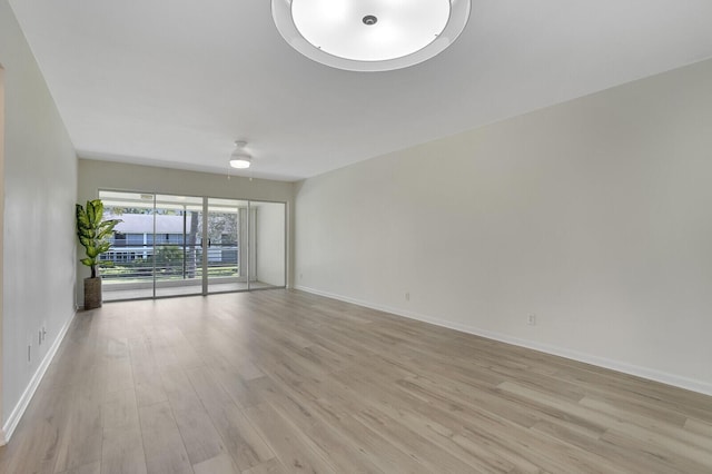 unfurnished room with light hardwood / wood-style floors