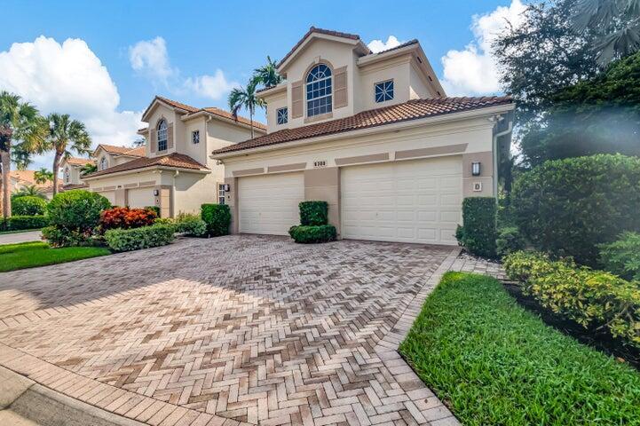 mediterranean / spanish-style house with a garage