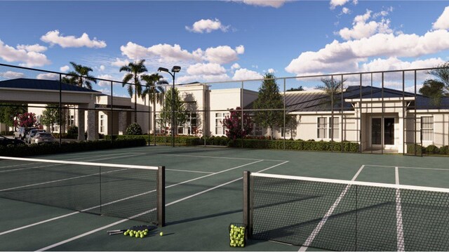 view of tennis court with fence