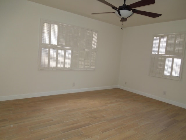 unfurnished room featuring light hardwood / wood-style floors and ceiling fan