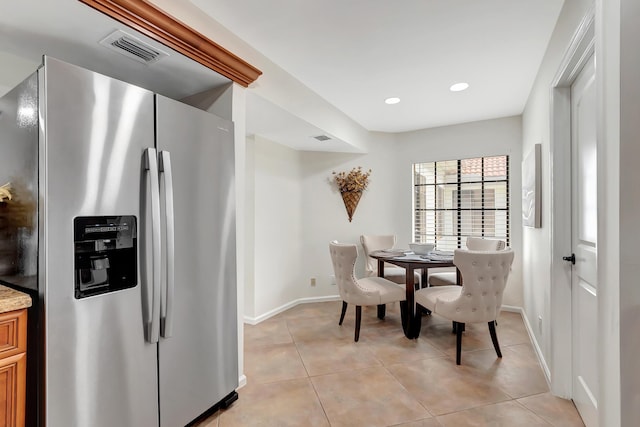 dining room with light tile patterned flooring