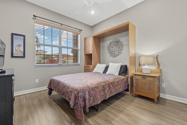 bedroom featuring ceiling fan and light wood-type flooring