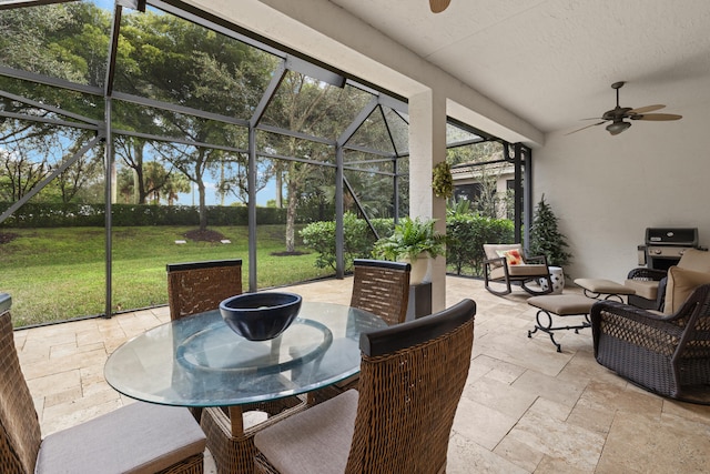 sunroom featuring ceiling fan