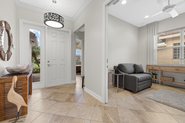 entryway featuring crown molding and ceiling fan