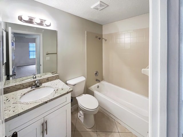 full bathroom with tile patterned flooring, toilet, a textured ceiling, vanity, and shower / bath combination