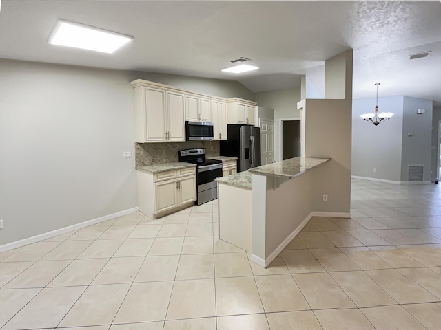 kitchen with a notable chandelier, appliances with stainless steel finishes, backsplash, vaulted ceiling, and light stone counters