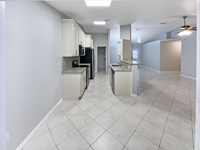 kitchen featuring range with electric stovetop, white cabinetry, tasteful backsplash, light stone countertops, and lofted ceiling