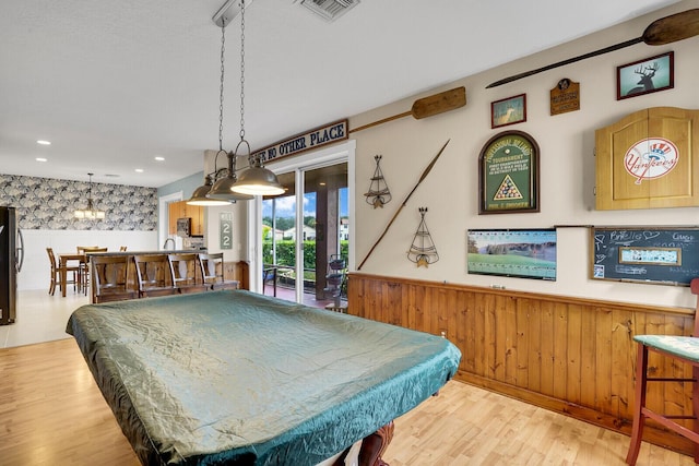 rec room with pool table and light hardwood / wood-style flooring