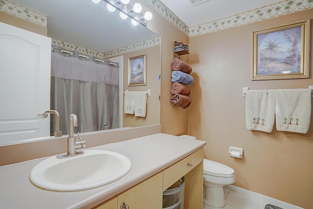 bathroom with vanity, curtained shower, tile patterned floors, and toilet