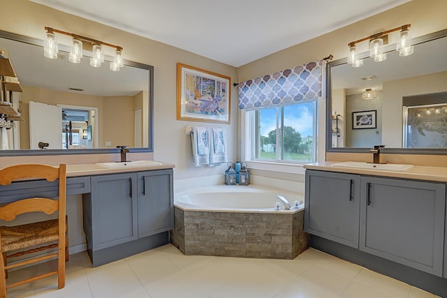 bathroom with tiled tub and vanity