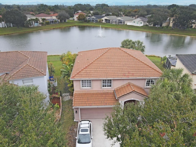 birds eye view of property featuring a water view