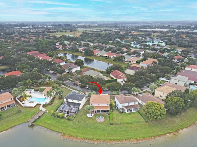 birds eye view of property with a water view