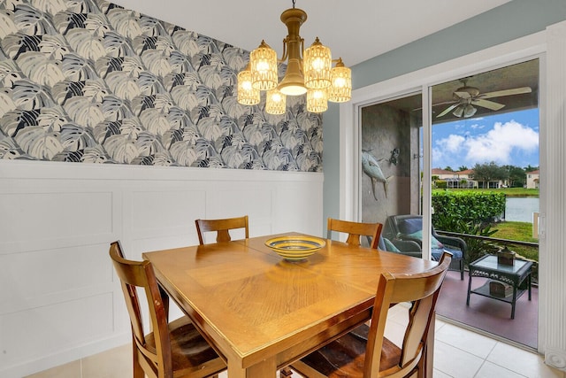 tiled dining space with ceiling fan